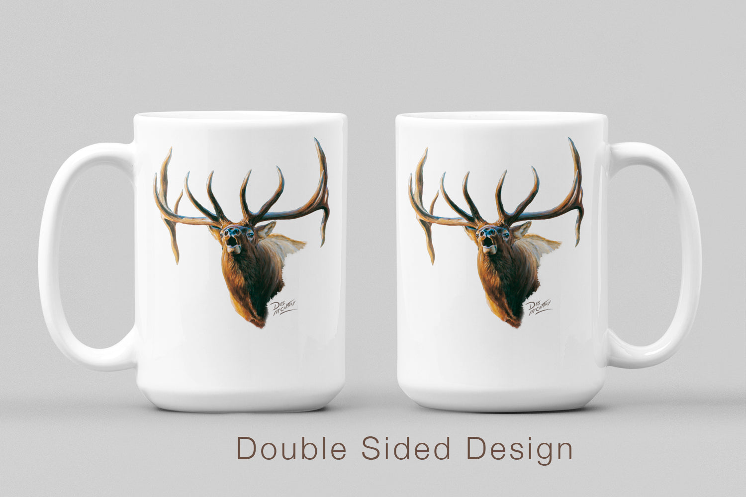 White ceramic coffee mug featuring a painting of a bull elk bugling in autumn, artwork by Canadian wildlife artist Des McCaffrey, displaying both sides of mug.