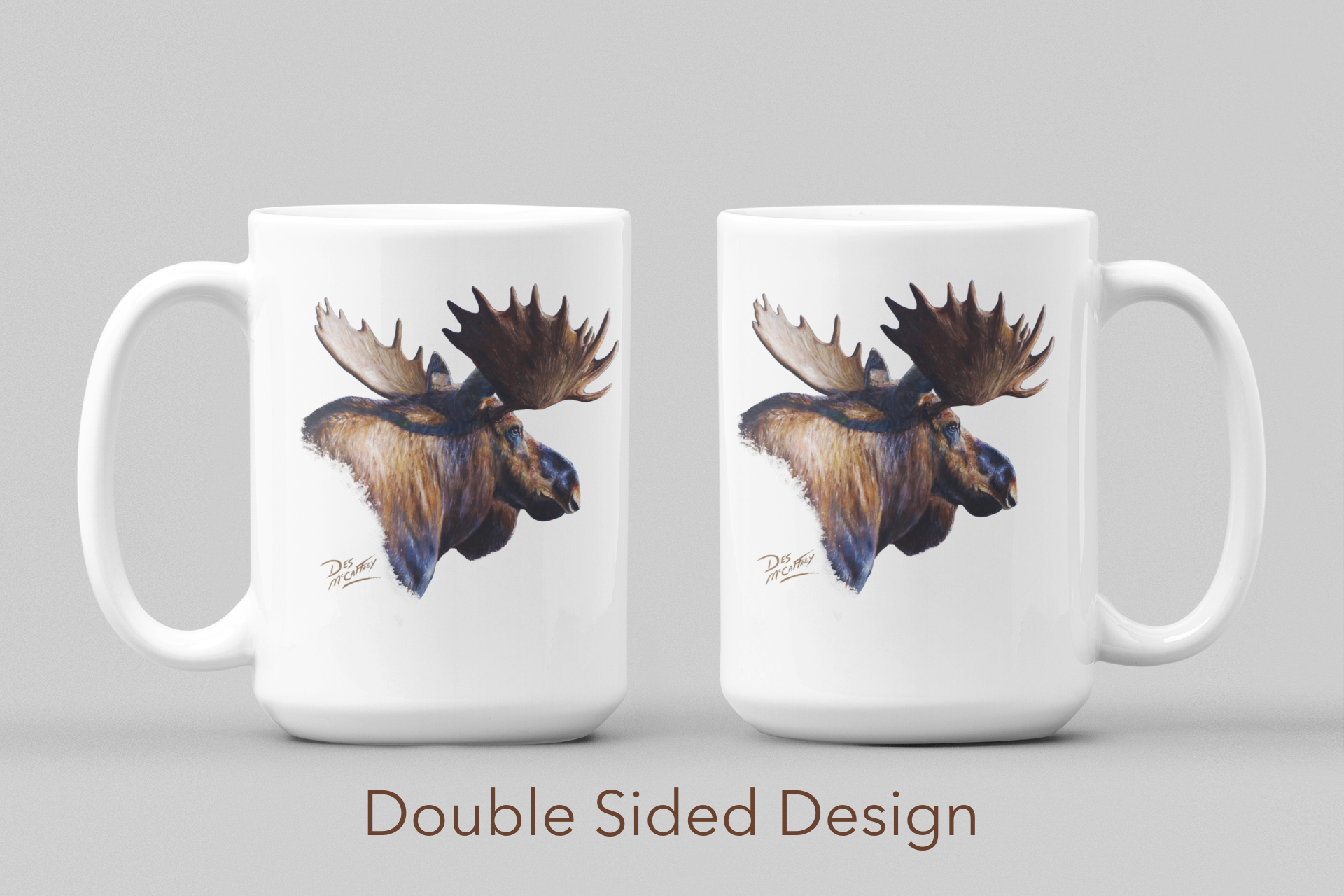 "Original wildlife painting of a bull moose in the northern Alberta wilderness by artist Des McCaffrey, printed on a white ceramic mug."
