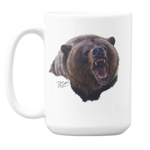 White ceramic coffee mug featuring a painting of a grizzly bear head in an aggressive posture, artwork by Canadian wildlife artist Des McCaffrey.