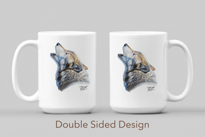 White ceramic coffee mug featuring a painting of a lone wolf howling against a winter sky, artwork by Canadian wildlife artist Des McCaffrey. Mug displayed on both sides. 