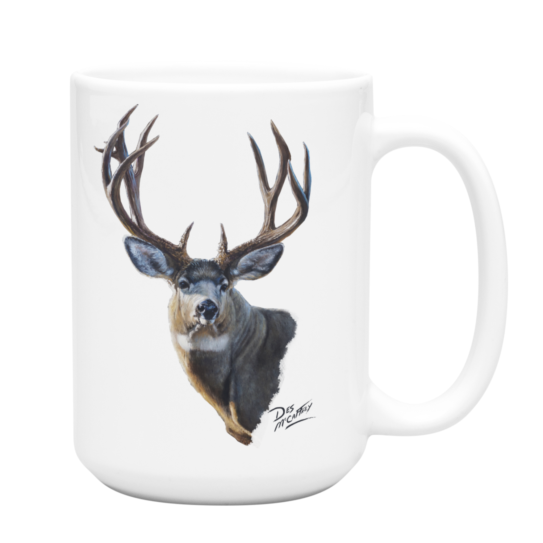 White ceramic coffee mug featuring a painting of a mule deer buck with large antlers, artwork by Canadian wildlife artist Des McCaffrey.